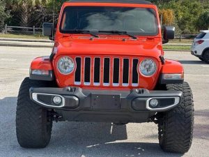 2018 Jeep Wrangler Unlimited Sahara 4dr SUV 4WD (3.6L 6cyl 8A) - Certified Pre-Owned Introduction Introducing the 2018 Jeep Wrangler Unlimited Sahara 4dr SUV 4WD (3.6L 6cyl 8A) - Certified Pre-Owned, a remarkable blend of rugged capability and modern comfort. This vehicle is not just a mode of transportation; it’s an adventure-ready companion designed to tackle both urban landscapes and off-road trails with equal prowess. With its iconic design, advanced features, and certified pre-owned status, this Jeep Wrangler is perfect for those who seek excitement in every journey. Exterior Features The exterior of the 2018 Jeep Wrangler Unlimited Sahara is instantly recognizable, showcasing the classic Jeep silhouette that has become synonymous with adventure. Its bold front grille, round headlights, and high ground clearance give it a commanding presence on the road. The Sahara trim adds unique styling elements such as body-colored fender flares and side steps that enhance both aesthetics and functionality. Color Options Available in a variety of striking colors, including Bright White, Granite Crystal Metallic, and Firecracker Red, this Jeep allows you to express your personality while enjoying its rugged capabilities. The durable exterior finish is designed to withstand the elements, ensuring that your vehicle looks great for years to come. Roof Options One of the standout features of the Wrangler Unlimited is its removable roof options. Whether you prefer an open-air experience with the soft top or a more secure hardtop for winter driving, this SUV offers versatility that few others can match. The easy-to-remove panels make transitioning from closed to open air seamless. Interior Comfort and Technology Step inside the 2018 Jeep Wrangler Unlimited Sahara, and you’ll find a well-appointed interior that balances ruggedness with comfort. The spacious cabin comfortably seats up to five passengers while providing ample cargo space for all your gear. Seating and Materials The Sahara trim features premium cloth seating surfaces with available leather upgrades that provide both comfort and durability. The front seats are designed with ample support for long drives or off-road adventures, while rear passengers enjoy generous legroom. Infotainment System Equipped with an intuitive Uconnect infotainment system, this Jeep offers seamless connectivity through Apple CarPlay and Android Auto integration. The large touchscreen display makes navigation simple while allowing access to music streaming services and hands-free calling capabilities. Sound System The available premium audio system delivers crystal-clear sound quality whether you’re cruising down the highway or navigating rocky terrain. Enjoy your favorite tunes through strategically placed speakers designed to enhance your listening experience. Performance Capabilities At the heart of the 2018 Jeep Wrangler Unlimited Sahara lies a powerful 3.6L V6 engine paired with an 8-speed automatic transmission. This combination provides robust performance both on- and off-road. Engine Specifications With an output of approximately 285 horsepower and 260 lb-ft of torque, this engine ensures responsive acceleration whether you’re merging onto highways or climbing steep inclines during off-road excursions. The four-wheel-drive system enhances traction on various surfaces, making it ideal for tackling challenging terrains like mud, sand, or snow. Off-Road Features The Wrangler’s legendary off-road capabilities are enhanced by features such as skid plates, heavy-duty axles, and an impressive approach angle that allows it to navigate obstacles effortlessly. With its high ground clearance and specialized suspension system, this SUV can conquer trails that would challenge lesser vehicles. Safety Features Safety is paramount in any vehicle purchase decision, especially when considering adventures beyond paved roads. The 2018 Jeep Wrangler Unlimited Sahara comes equipped with numerous safety features designed to protect occupants in various driving conditions. Advanced Safety Technologies This model includes advanced safety technologies such as: Rearview Camera: Provides visibility when reversing. Blind Spot Monitoring: Alerts drivers to vehicles in their blind spots. ParkSense Rear Park Assist: Helps detect obstacles when parking. Electronic Stability Control: Enhances vehicle stability during challenging maneuvers. These features work together to provide peace of mind whether you’re navigating city streets or exploring remote trails. Certified Pre-Owned Assurance Purchasing a certified pre-owned vehicle like the 2018 Jeep Wrangler Unlimited Sahara means you’re getting more than just a used car; you’re investing in quality assurance backed by rigorous inspection standards set by manufacturers. Certification Process To achieve certified pre-owned status: The vehicle must pass a comprehensive multi-point inspection covering mechanical systems, interior condition, exterior appearance, tires/brakes condition. It must have a clean title history without significant damage. It typically comes with extended warranties offering additional coverage beyond standard used car warranties. This certification provides buyers confidence knowing they are acquiring a reliable vehicle ready for adventures ahead. Conclusion In summary, the 2018 Jeep Wrangler Unlimited Sahara 4dr SUV 4WD (3.6L 6cyl 8A) - Certified Pre-Owned stands out as an exceptional choice for those seeking versatility combined with rugged performance. Its iconic design captures attention while offering modern comforts inside—a perfect blend for daily commutes or weekend getaways into nature’s embrace. 2018 Jeep Wrangler Unlimited Sahara 4dr SUV 4WD (3.6L 6cyl 8A) - Certified Pre-Owned Introduction Introducing the 2018 Jeep Wrangler Unlimited Sahara 4dr SUV 4WD (3.6L 6cyl 8A) - Certified Pre-Owned, a remarkable blend of rugged capability and modern comfort. This vehicle is not just a mode of transportation; it’s an adventure-ready companion designed to tackle both urban landscapes and off-road trails with equal prowess. With its iconic design, advanced features, and certified pre-owned status, this Jeep Wrangler is perfect for those who seek excitement in every journey. Exterior Features The exterior of the 2018 Jeep Wrangler Unlimited Sahara is instantly recognizable, showcasing the classic Jeep silhouette that has become synonymous with adventure. Its bold front grille, round headlights, and high ground clearance give it a commanding presence on the road. The Sahara trim adds unique styling elements such as body-colored fender flares and side steps that enhance both aesthetics and functionality. Color Options Available in a variety of striking colors, including Bright White, Granite Crystal Metallic, and Firecracker Red, this Jeep allows you to express your personality while enjoying its rugged capabilities. The durable exterior finish is designed to withstand the elements, ensuring that your vehicle looks great for years to come. Roof Options One of the standout features of the Wrangler Unlimited is its removable roof options. Whether you prefer an open-air experience with the soft top or a more secure hardtop for winter driving, this SUV offers versatility that few others can match. The easy-to-remove panels make transitioning from closed to open air seamless. Interior Comfort and Technology Step inside the 2018 Jeep Wrangler Unlimited Sahara, and you’ll find a well-appointed interior that balances ruggedness with comfort. The spacious cabin comfortably seats up to five passengers while providing ample cargo space for all your gear. Seating and Materials The Sahara trim features premium cloth seating surfaces with available leather upgrades that provide both comfort and durability. The front seats are designed with ample support for long drives or off-road adventures, while rear passengers enjoy generous legroom. Infotainment System Equipped with an intuitive Uconnect infotainment system, this Jeep offers seamless connectivity through Apple CarPlay and Android Auto integration. The large touchscreen display makes navigation simple while allowing access to music streaming services and hands-free calling capabilities. Sound System The available premium audio system delivers crystal-clear sound quality whether you’re cruising down the highway or navigating rocky terrain. Enjoy your favorite tunes through strategically placed speakers designed to enhance your listening experience. Performance Capabilities At the heart of the 2018 Jeep Wrangler Unlimited Sahara lies a powerful 3.6L V6 engine paired with an 8-speed automatic transmission. This combination provides robust performance both on- and off-road. Engine Specifications With an output of approximately 285 horsepower and 260 lb-ft of torque, this engine ensures responsive acceleration whether you’re merging onto highways or climbing steep inclines during off-road excursions. The four-wheel-drive system enhances traction on various surfaces, making it ideal for tackling challenging terrains like mud, sand, or snow. Off-Road Features The Wrangler’s legendary off-road capabilities are enhanced by features such as skid plates, heavy-duty axles, and an impressive approach angle that allows it to navigate obstacles effortlessly. With its high ground clearance and specialized suspension system, this SUV can conquer trails that would challenge lesser vehicles. Safety Features Safety is paramount in any vehicle purchase decision, especially when considering adventures beyond paved roads. The 2018 Jeep Wrangler Unlimited Sahara comes equipped with numerous safety features designed to protect occupants in various driving conditions. Advanced Safety Technologies This model includes advanced safety technologies such as: Rearview Camera: Provides visibility when reversing. Blind Spot Monitoring: Alerts drivers to vehicles in their blind spots. ParkSense Rear Park Assist: Helps detect obstacles when parking. Electronic Stability Control: Enhances vehicle stability during challenging maneuvers. These features work together to provide peace of mind whether you’re navigating city streets or exploring remote trails. Certified Pre-Owned Assurance Purchasing a certified pre-owned vehicle like the 2018 Jeep Wrangler Unlimited Sahara means you’re getting more than just a used car; you’re investing in quality assurance backed by rigorous inspection standards set by manufacturers. Certification Process To achieve certified pre-owned status: The vehicle must pass a comprehensive multi-point inspection covering mechanical systems, interior condition, exterior appearance, tires/brakes condition. It must have a clean title history without significant damage. It typically comes with extended warranties offering additional coverage beyond standard used car warranties. This certification provides buyers confidence knowing they are acquiring a reliable vehicle ready for adventures ahead. Conclusion In summary, the 2018 Jeep Wrangler Unlimited Sahara 4dr SUV 4WD (3.6L 6cyl 8A) - Certified Pre-Owned stands out as an exceptional choice for those seeking versatility combined with rugged performance. Its iconic design captures attention while offering modern comforts inside—a perfect blend for daily commutes or weekend getaways into nature’s embrace. 2018 Jeep Wrangler Unlimited Sahara 4dr SUV 4WD (3.6L 6cyl 8A) - Certified Pre-Owned